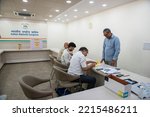 Small photo of New Delhi, India- Oct 17 2022: Congress workers and Returning officer prepares voters slip at All India Congress Committee (AICC), election held for congress party President