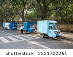 Small photo of New Delhi, India-Nov 2 2022: Electric three wheeler pick up vehicles parked at Roadside in Delhi road, India. Piaggio Ape E-Xtra is an electric three wheeler tempo.