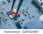 Small photo of Flag of USA and China on a processor, CPU or GPU microchip on a motherboard. US companies have become the latest collateral damage in US - China tech war. US limits, restricts AI chips sales to China.