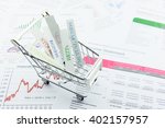 Small photo of Various asset types in a shopping cart. An ideal investment that diversifies every assets in a portfolio to minimize unsystematic risk for risk averse investors. Financial asset allocation concept.