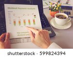 Value investor or VI sees a dividend payment analysis report on his table. This type of financial charts include stacks of bar and line charts compare between the final and interim payment each year.