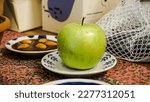 Small photo of Apple symbol in Nowruz table. apples in Norooz setting. Haft sin in Norouz haft seen table. Persian new year