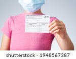 Small photo of 04-02-2021 Clarksburg, MD, USA: It is expected that kids will be getting vaccines before the start of the school year. Concept image showing a vaccination record card