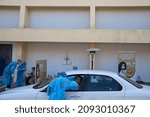 Small photo of Tirnavos, Larisa, Greece - November 16, 2020. Medical workers wearing special suits to protect against coronavirus, conduct a "drive through" rapid testing for covid-19.