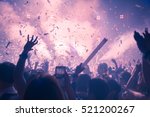 Abstract Background Party Concert Concept. Party people concept. Crowd happy and joyful in club. Celebration, festival, Happiness,  Blurry night club .Event Show concert  EDM on stage.