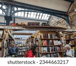 Small photo of Alnwick, Northumberland, England, UK. May 7, 2023. The Barter Books bookshop with model train, inside the old railway station.