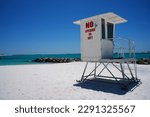 No Life Guard on Duty Painted on Life Guard Tower Overlooking White Beach in Florida