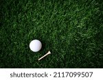 Small photo of Golf ball close up on green grass on blurred beautiful landscape of golf background.Concept international sport that rely on precision skills for health relaxation.