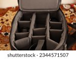 Closeup Shot of an opened Black DSLR camera bag with partitions 