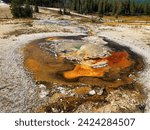 Small photo of Tardy Geyser in Yellowstone National Park in Wyoming.