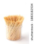 Small photo of Group of Toothpick in container isolated on white background, Toothpick is a piece of wooden, small, short stick and peaked, It's device for removing food particles or dirt between teeth. Tableware.