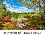 Small photo of Mayview lake in autumn colors. Beautiful lake with gazebo and fountain on autumn morning. Broyhill Park, Blowing Rock, near Blue Ridge Parkway, North Carolina, USA.