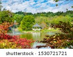 Small photo of Mayview lake in autumn colors. Beautiful lake with gazebo and fountain on autumn morning. Broyhill Park, Blowing Rock, near Blue Ridge Parkway, North Carolina, USA.