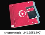 A close up of a floppy disk with inverted colors.