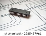 Small photo of 32-legged integrated circuit. Semiconductor component on an electronic schema.