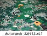 Digital circuits background. Close up of semiconductor components on electronic circuit board. High tech pattern with chips.