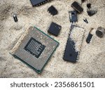 Small photo of Semiconductor components on the sand. Cpu, microchip, integrated circuits, transistors and diodes.