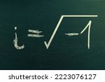 Small photo of Complex math learning and formula on a chalkboard. i equals square root of negative 1. Handwritten on chalkboard