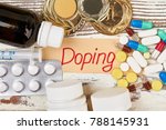 Small photo of Drugs and undeserved medals. "Doping" lettering beside tablets, capsules and bottles. Sports and crime.