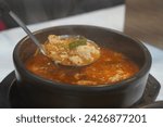 Small photo of Soft Bean Curd Stew is one of the most popular traditional Korean foods. It is a stew made by boiling soft and savory soft tofu with various ingredients. Soft tofu stew is spicy and savory.
