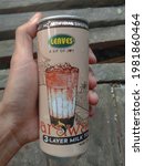 Small photo of SARAWAK MALAYSIA-MAY 29,2021: Hand hold a LEAVES Sarawak Three Layer Milk Tea can, Original Brand From Sarawak Famous traditional local drinks.