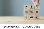 Small photo of Soft skills concept. Used for presentation, banner. Hand puts wooden cubes with icons of "SOFT SKILLS" ; creativity, EQ, Problem solving, persuasion, collaboration, adaptability on grey background.