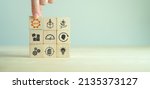 Small photo of MVP, minimum viable product concept for lean startup. New product release planning. Analysis and market validation. Hand puts wooden cubes with abbreviation MVP and learn, build, measure icons.