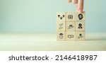 Small photo of Business ethics concept. Ethics inside human mind. Business integrity and moral. Putting wooden cubes with ethics inside a head standing with other ethics icon. Company culture and sustainable success