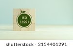 Small photo of ISO 14001 certified environmental management systems. Requirements for an environmental management system for organization can use to enhance environmental performance. ISO 14001 on wooden cubes.