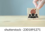Small photo of Target customer, buyer persona, marketing segmentation, job recruitment concept. Personalization marketing, customer centric strategies. Wooden cubes with target customer icon on smart background.
