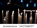 candles lit in the church for a ... | Shutterstock . vector #1427368457
