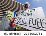 Small photo of A group of climate activists protest outside the Los Angeles Department of Water and Power headquarters regarding the city's plan to transition to 100% renewable energy, in Los Angeles, July 26, 2022.