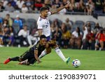 Small photo of Los Angeles FC midfielder Latif Blessing (7) and D.C. United midfielder Victor Palsson (44) vie for the ball during an MLS soccer match Saturday, Aug. 16, 2022, in Los Angeles.