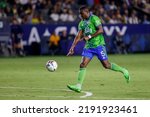 Small photo of Seattle Sounders defender Nouhou (5) points at the ball against the LA Galaxy during an MLS soccer match July 17, 2022, in Carson, Calif.