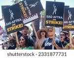 Small photo of Striking writers and actors walk with pickets outside Sunset Bronson studios in Los Angeles on Friday, July 14, 2023.