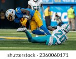 Small photo of Los Angeles Chargers wide receiver Derius Davis (12) and Miami Dolphins cornerback Justin Bethel (20) in actions during an NFL football game, Sept. 10, 2023, in Inglewood, Calif.