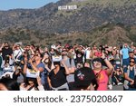 Small photo of Solar enthusiasts view a partial solar eclipse through special protective glasses at the Griffith Observatory to watch the solar eclipse in Los Angeles Saturday, Oct. 14, 2023.