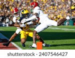 Small photo of Michigan wide receiver Semaj Morgan (C) is brought down by Alabama defensive back tight end Terrion Arnold (R) during the 2024 Rose Bowl game Monday, Jan. 1, 2024, in Pasadena, Calif.
