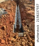 Small photo of Underground precast concrete box culvert drain under construction at the construction site. It is used to channel storm water to prevent flash floods.