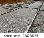 Small photo of Compacted crusher run before lay of reinforcement bar for ground slab construction.