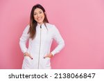 Small photo of Beautiful Brazilian Caucasian Woman Professional Beautician, Cosmetologist, Smiling, happy and optimistic, posing for photo with hands in pockets.