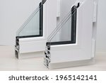Small photo of Samples of plastic windows in a section. PVC window profiles and double-glazed windows for exhibition, sectional samples. Energy saving technologies, plastic pvc windows.