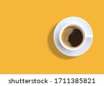 cup of espresso coffee on yellow background. Zenith
