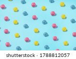 Colorful Woolen Balls on a bright blue background. Summer colors inspired art photography. Cotton Candy overload in yellow, pink, and blue colors.