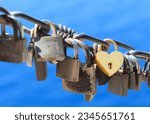 Yellow heart shaped padlock as...