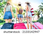 Small photo of Female love to travel, they walk the streets of the city with their luggage in their suitcase, they arrived on vacation! - Girls with their bags are ready for the trip - Holidays, fun, relax concept