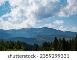 Small photo of Mountain view in Colorardo with cloudy sky and tress