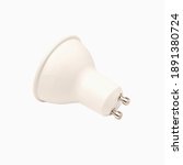 Small photo of Energy saving 10W LED bulb with GU10 socket isolated on white background