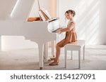Little girl playing piano...