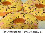 yellow donuts lie next to each... | Shutterstock . vector #1910450671